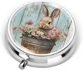 Portable Round 3 Compartment Metal Pill Box Features a Bunny in a Bucket Filled with Flowers for Organizing Medications Travel Essentials and Gift Giving