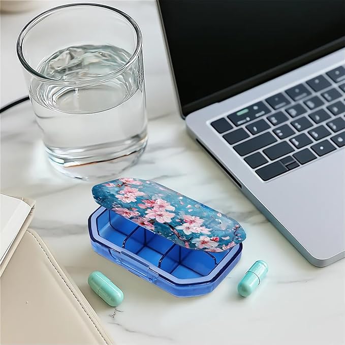 This Watercolor Style Cherry Blossom Tree Pattern 6 Compartment Pill Box Can Be Placed in A Pocket Or Wallet to Store Vitamins, Medicines Other Medications.