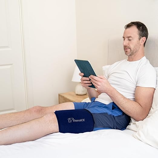 TheraICE Knee Ice Pack Wrap Compression ANYSleeve for Injuries, Reusable Gel Cold Packs Brace for Elbow & Calf - Flexible Cold Wrap Recovery for Pain Relief (One Size fits most people & Body parts)