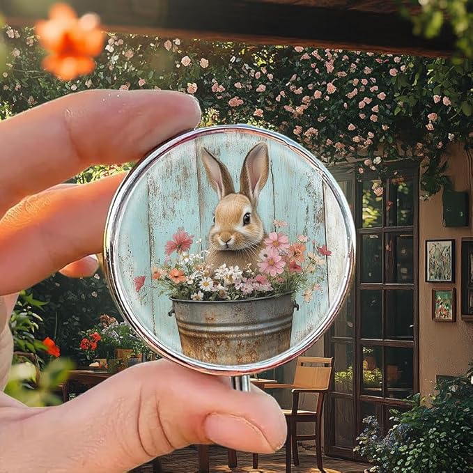 Portable Round 3 Compartment Metal Pill Box Features a Bunny in a Bucket Filled with Flowers for Organizing Medications Travel Essentials and Gift Giving